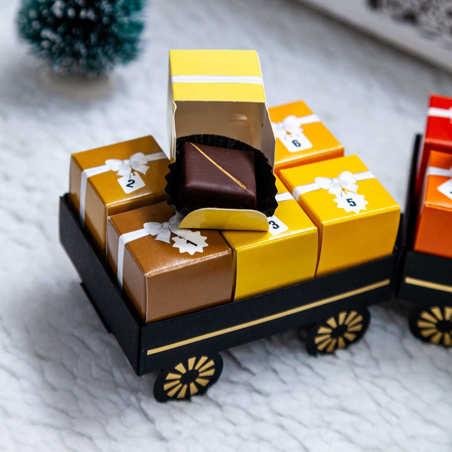 Calendrier de l'Avent - Le Train 2 Calendrier de l'Avent chocolat artisanal - Maison BUET Lausanne - Le Train
